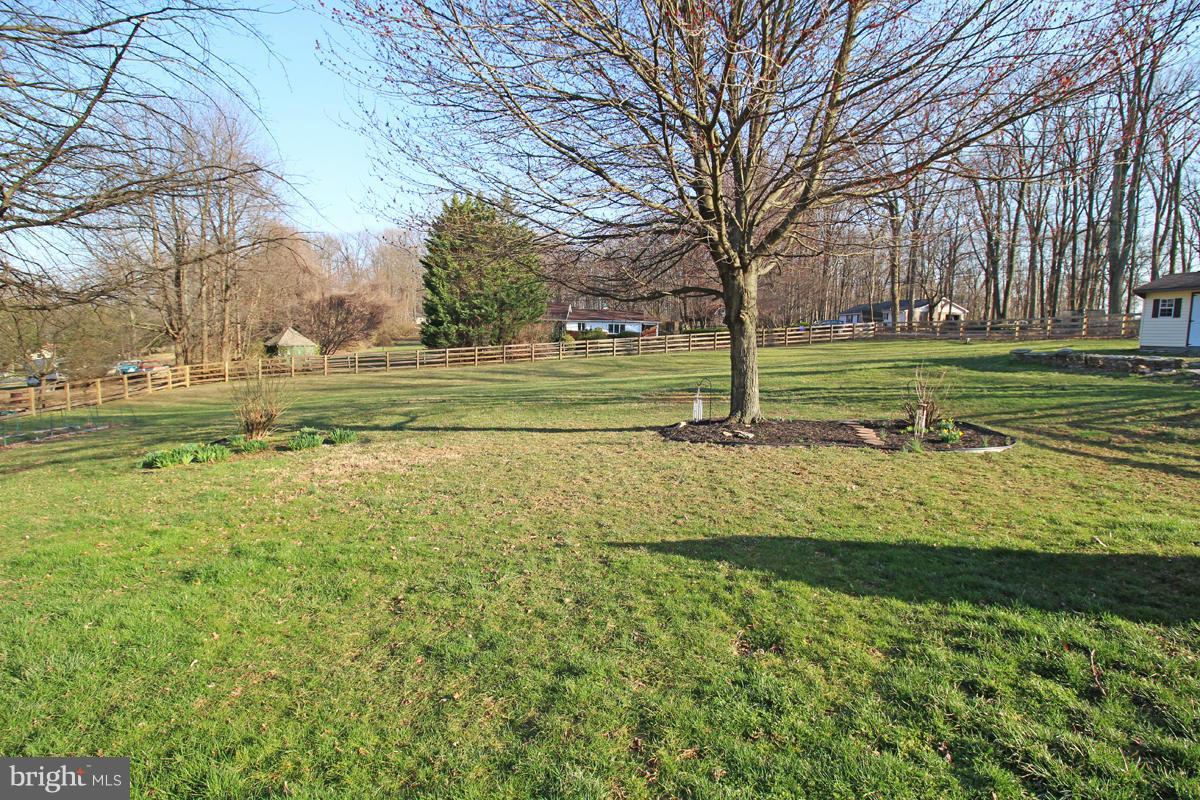 6603 South Clifton Road Frederick, MD 21703 - Photo 20 of 21 a view of a golf course with a lake