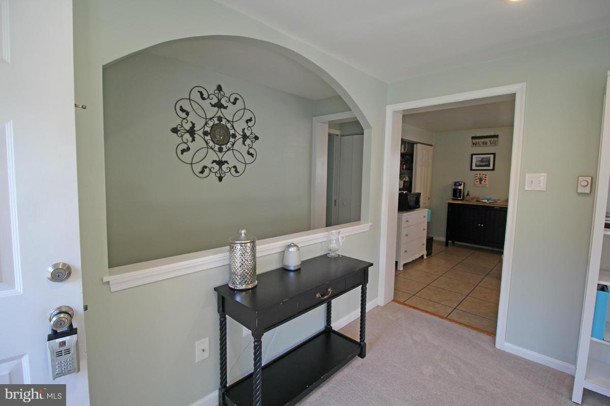 6603 South Clifton Road Frederick, MD 21703 - Photo 3 of 21 a view of a hallway and interior of a house