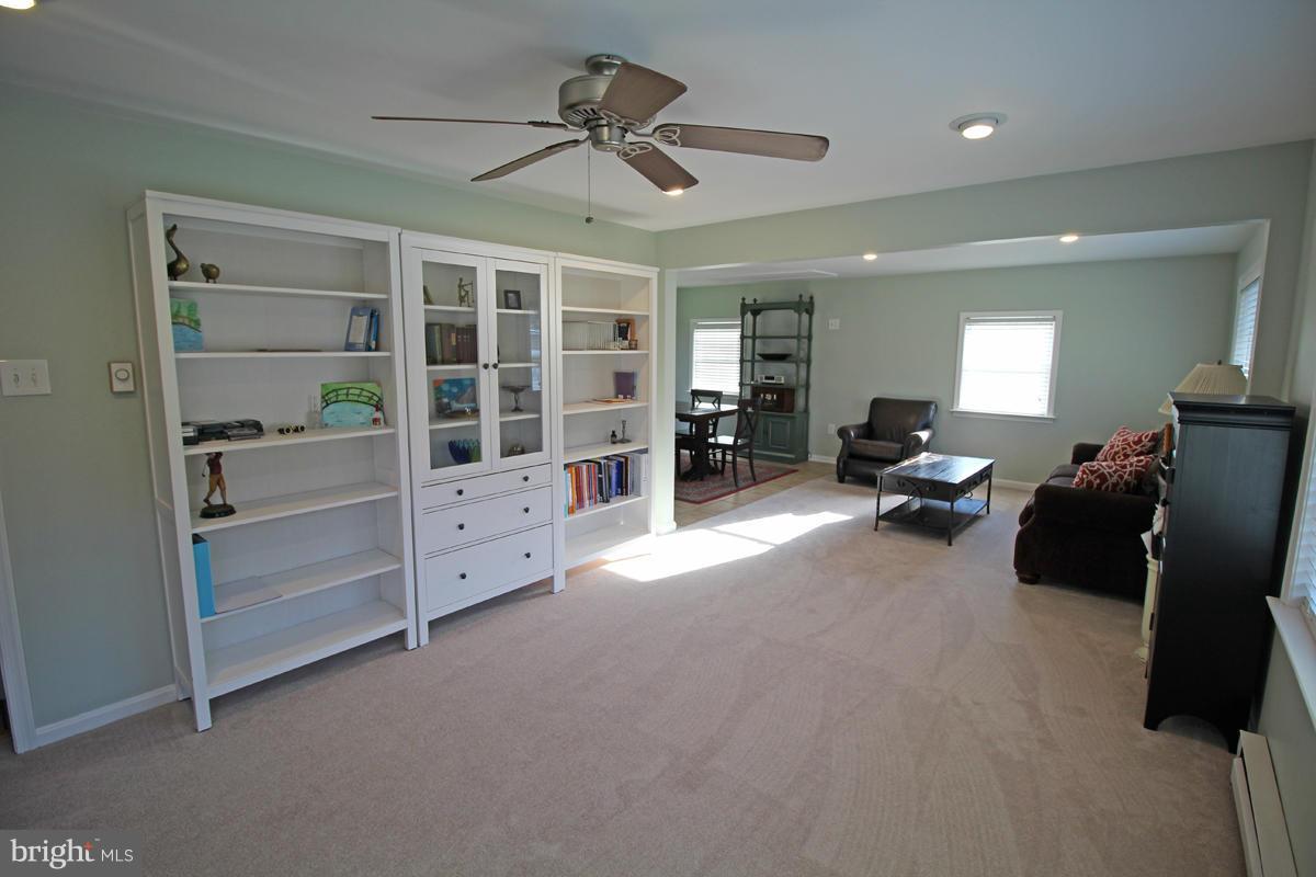 6603 South Clifton Road Frederick, MD 21703 - Photo 5 of 21 a living room with furniture and gym equipment