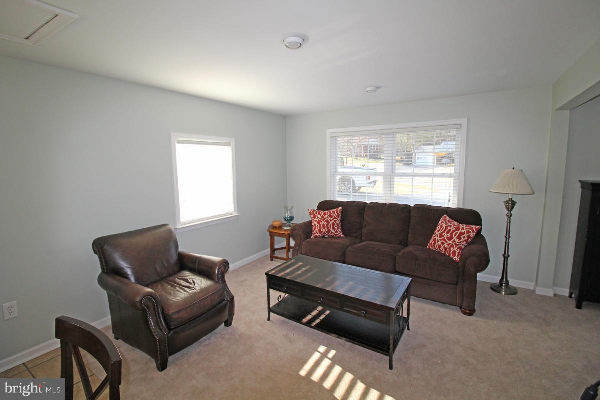 6603 South Clifton Road Frederick, MD 21703 - Photo 7 of 21 a living room with a couch and a window