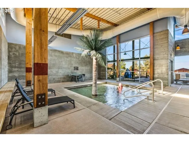 a view of a house with swimming pool and a small yard