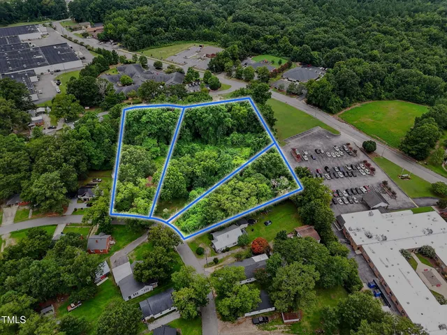 an aerial view of houses with yard