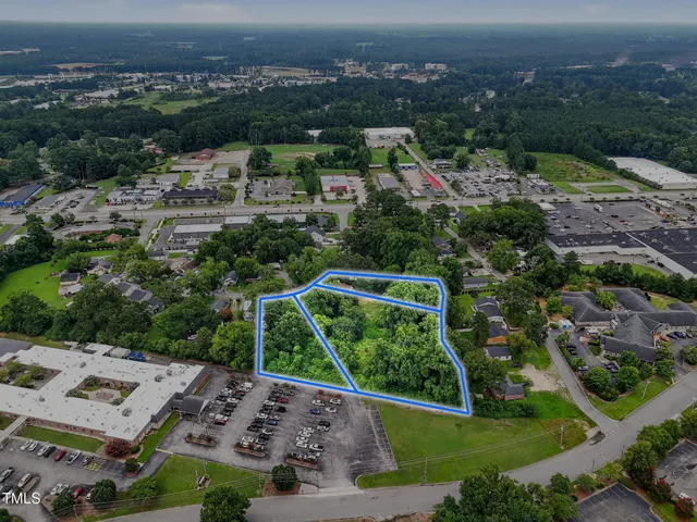 a view of residential houses with snow