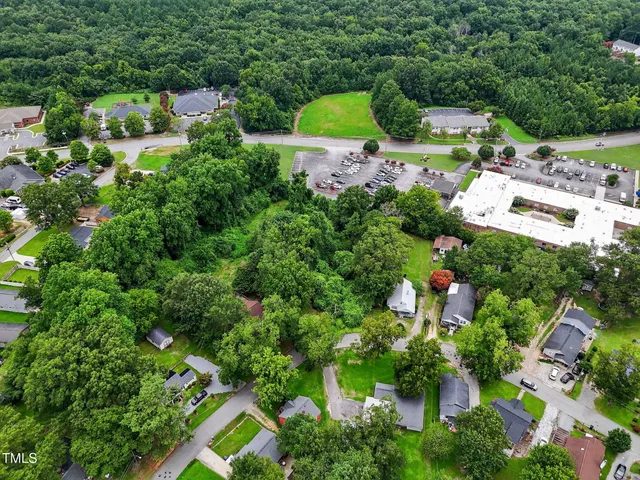 an aerial view of residential house with outdoor space and swimming pool