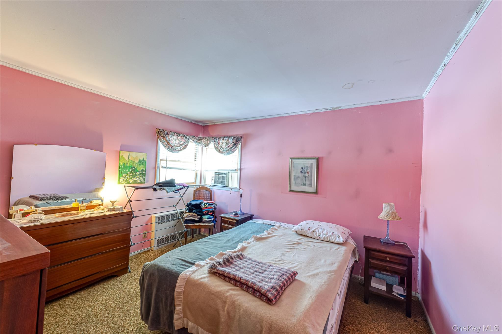 67 Edgewood Road West Islip, NY 11795 - Photo 13 of 31 a bedroom with a bed and a window