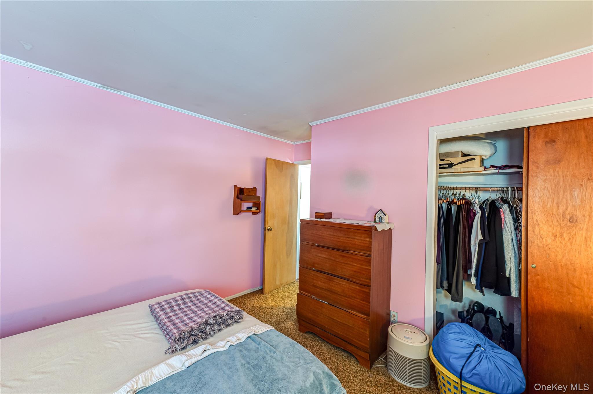 67 Edgewood Road West Islip, NY 11795 - Photo 14 of 31 a bedroom with a bed and a closet