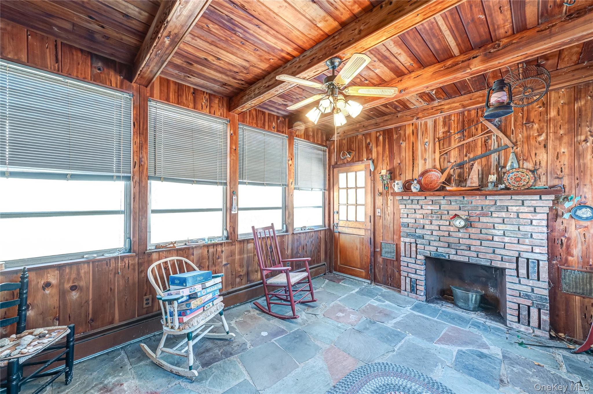 67 Edgewood Road West Islip, NY 11795 - Photo 17 of 31 a living room with furniture a fireplace and a table