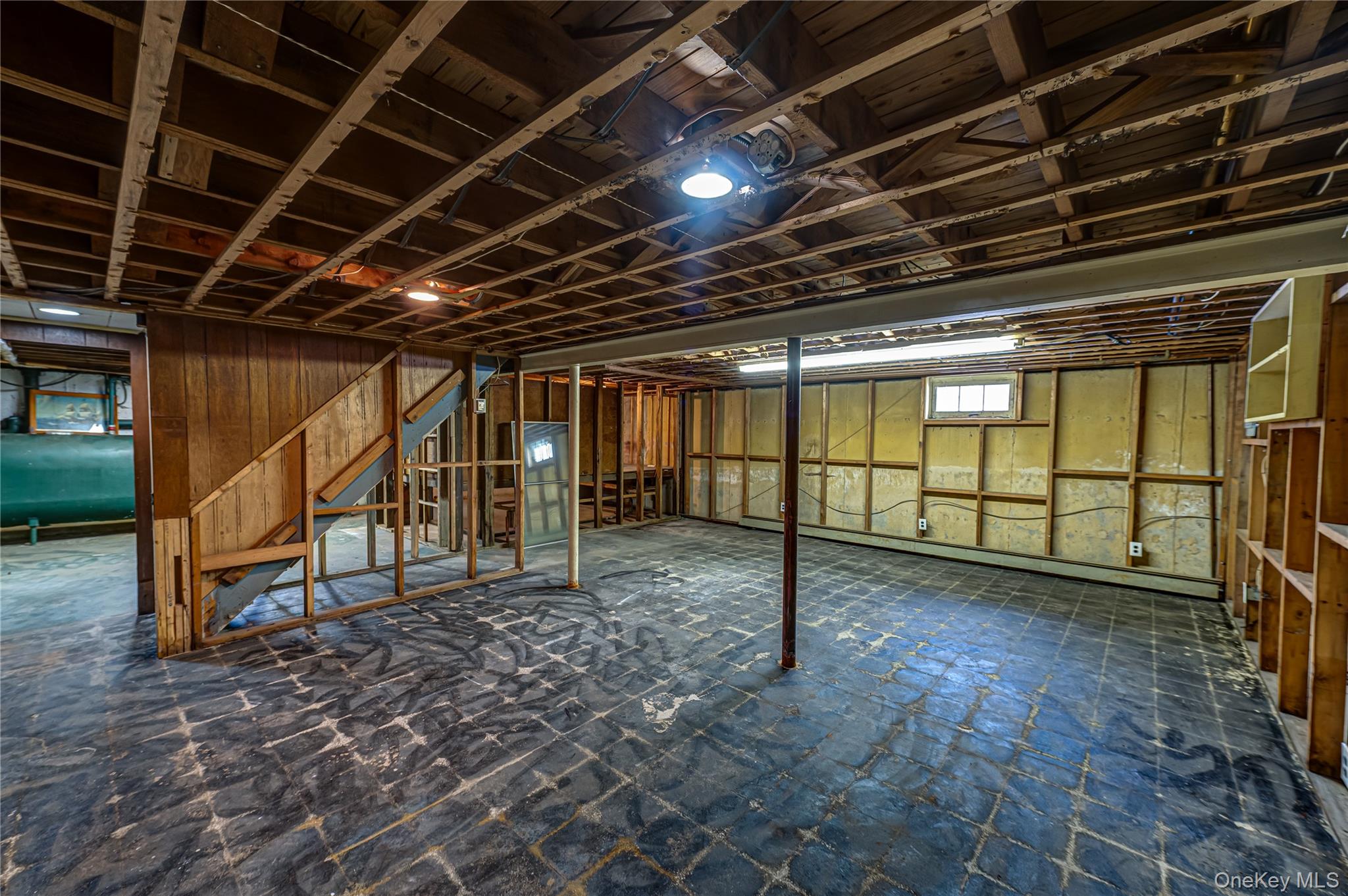 67 Edgewood Road West Islip, NY 11795 - Photo 23 of 31 a view of an empty room with wooden walls