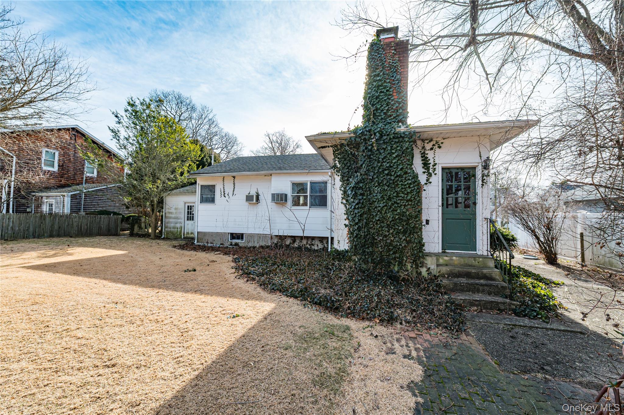 67 Edgewood Road West Islip, NY 11795 - Photo 28 of 31 a front view of a house with a yard and garage