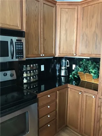 a kitchen with a refrigerator and cabinets