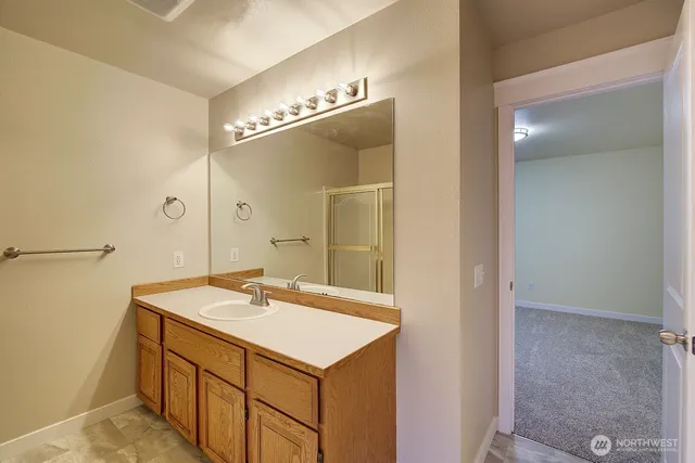 a bathroom with a sink and mirror