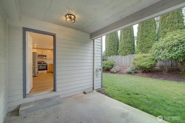a view of a back yard from a room