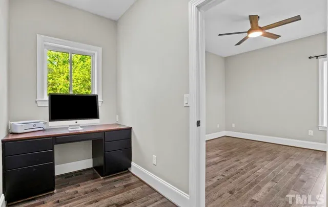 a view of a garage with a furniture and cars