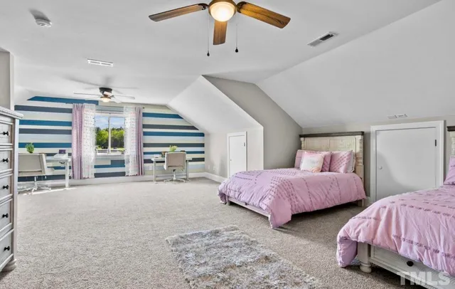 an aerial view of a house with a swimming pool