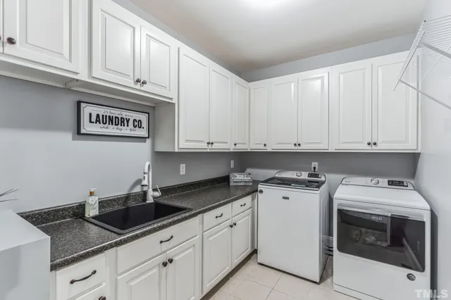 a bathroom with a shower and a sink