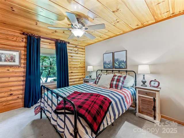 a bedroom with bed and a window