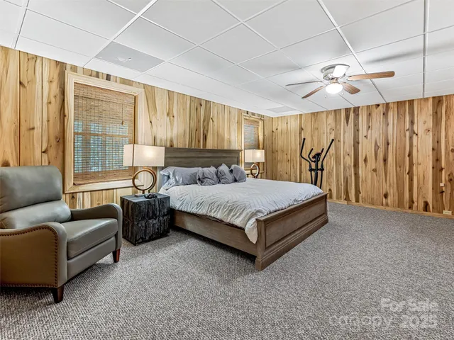 a bedroom with a bed couch and window