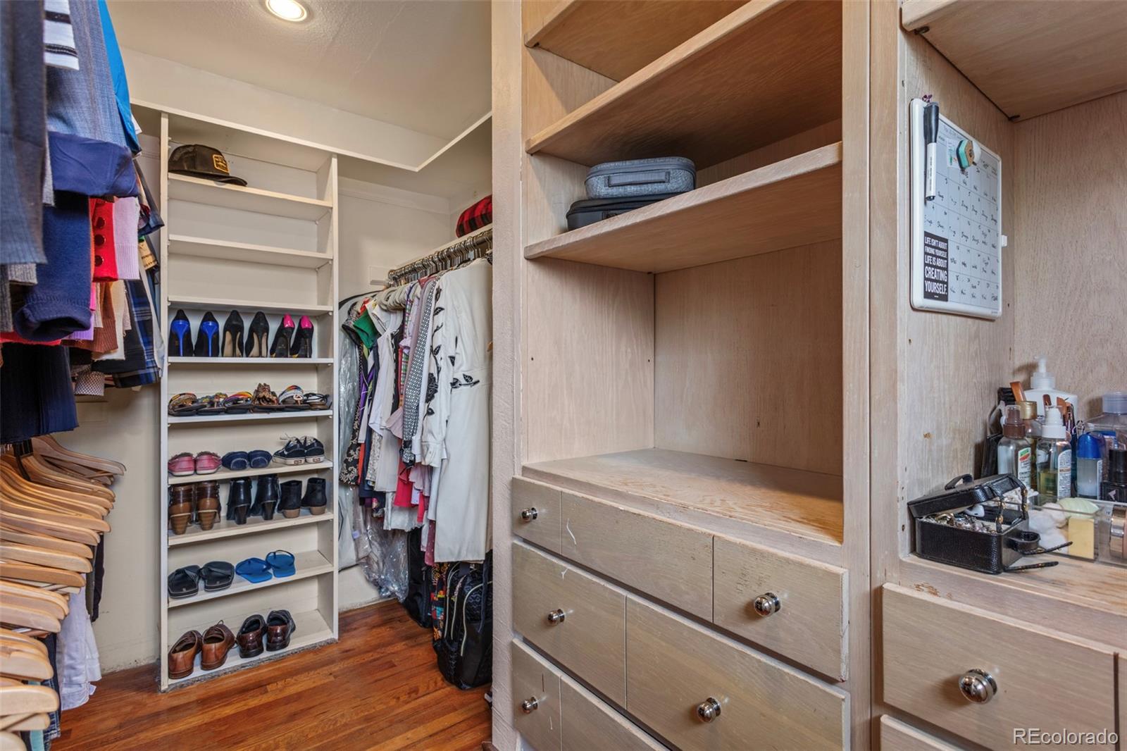 7296 Raritan Street Denver, CO 80221 - Photo 11 of 23 a view of walk in closet with clothes and shoes