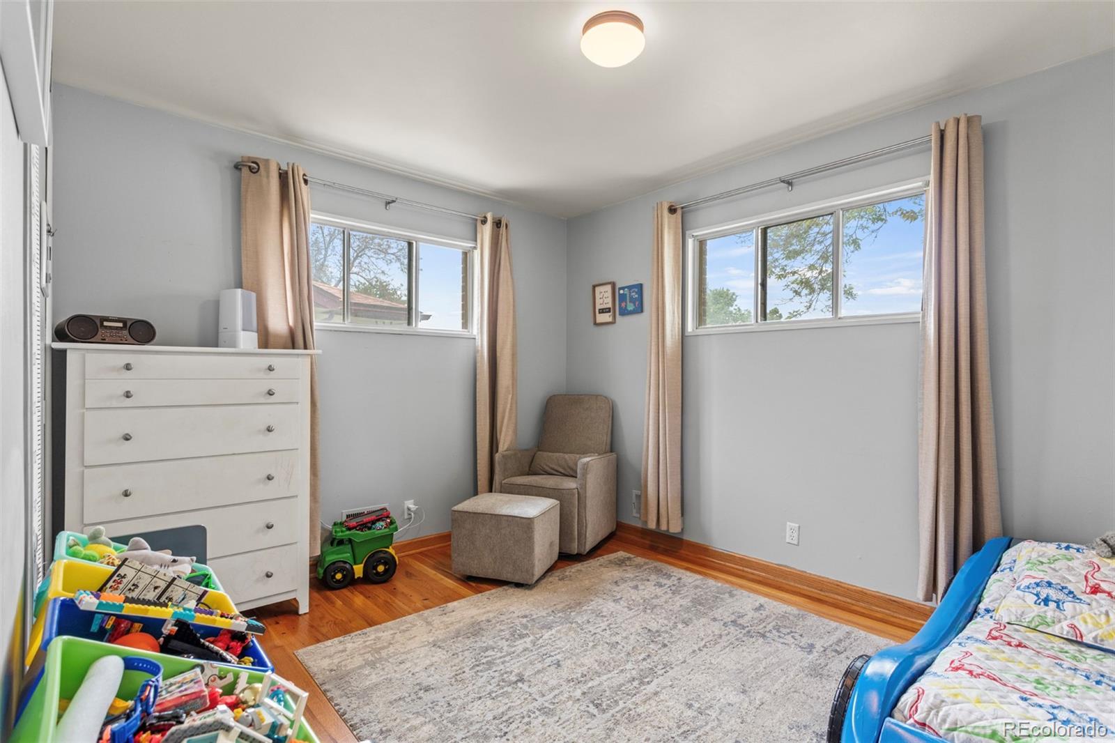 7296 Raritan Street Denver, CO 80221 - Photo 12 of 23 a bedroom with bed and a window