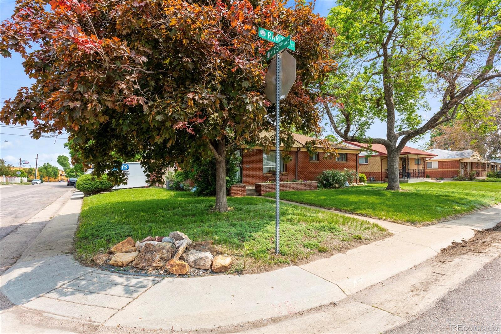 7296 Raritan Street Denver, CO 80221 - Photo 2 of 23 a garden with trees in the background