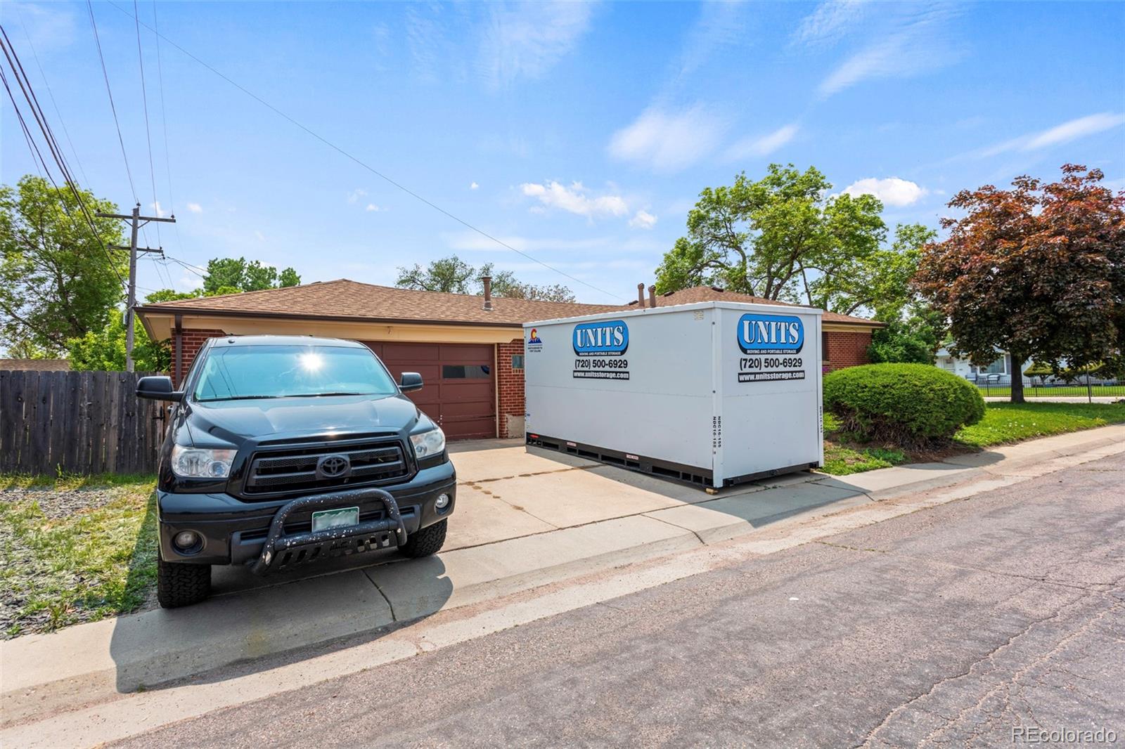 7296 Raritan Street Denver, CO 80221 - Photo 23 of 23 a car parked in front of a house