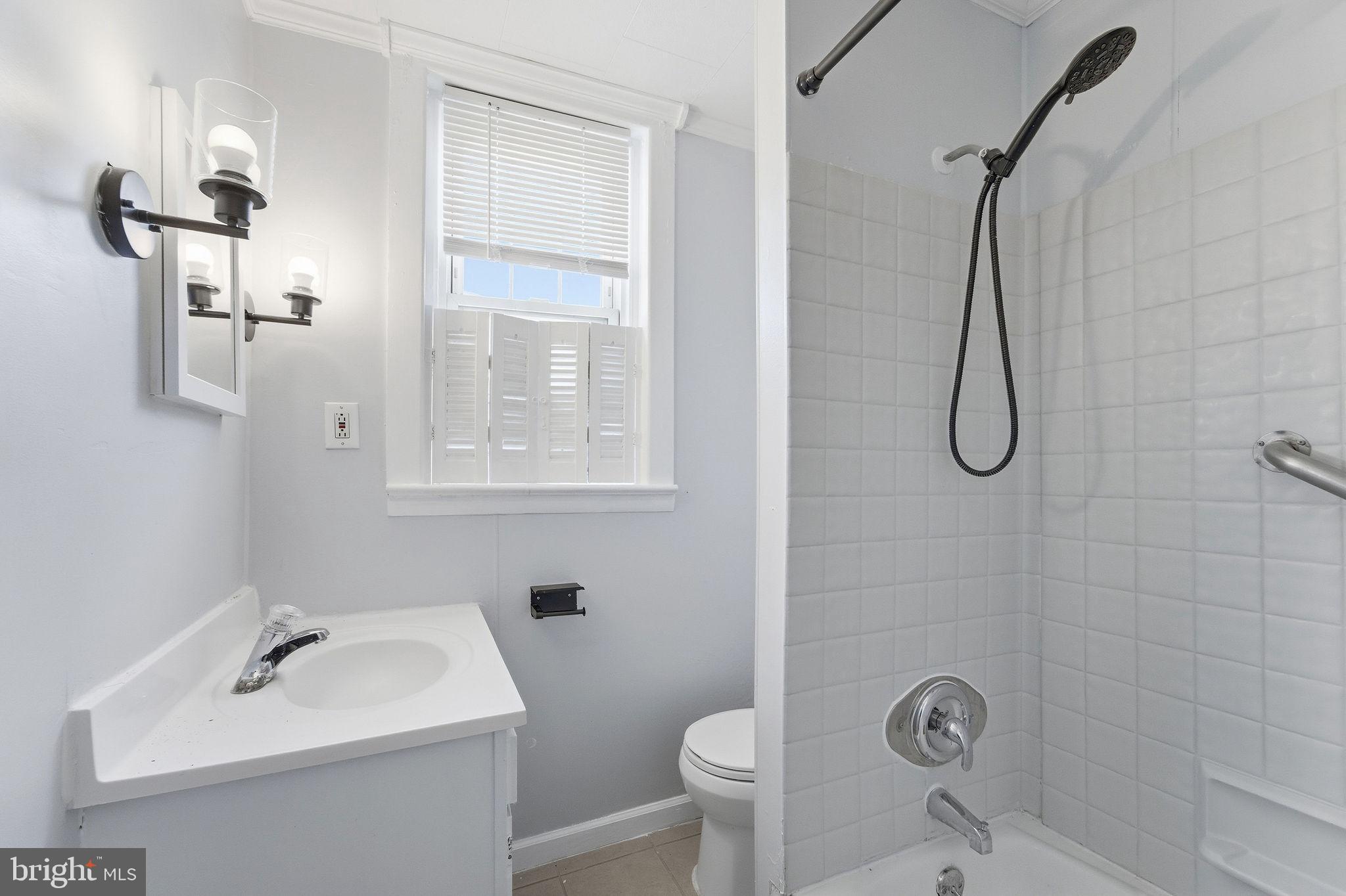 601 Hunter Street Gloucester City, NJ 08030 - Photo 20 of 35 a bathroom with a sink toilet and shower