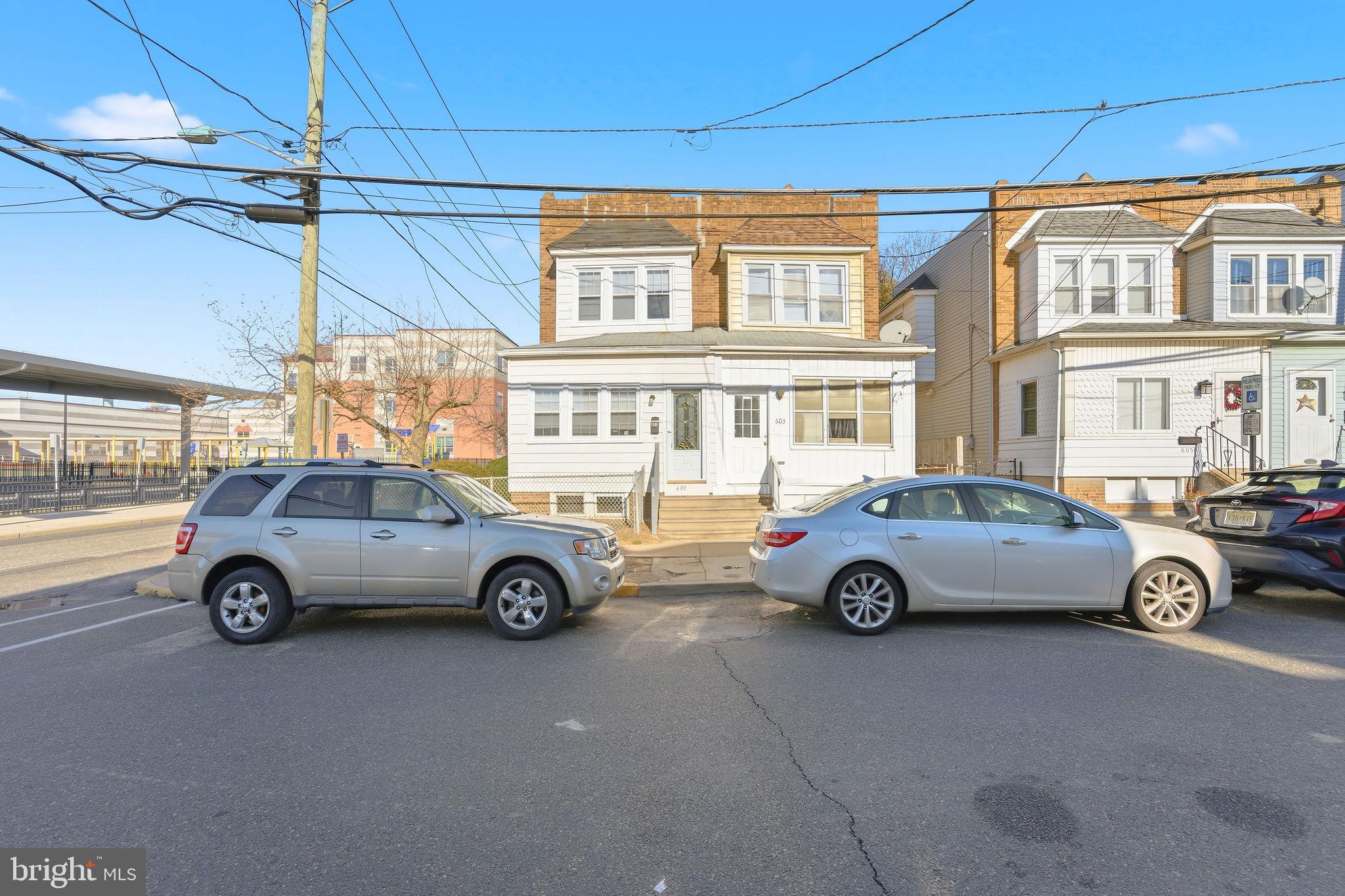 601 Hunter Street Gloucester City, NJ 08030 - Photo 2 of 35 a car parked in front of a house
