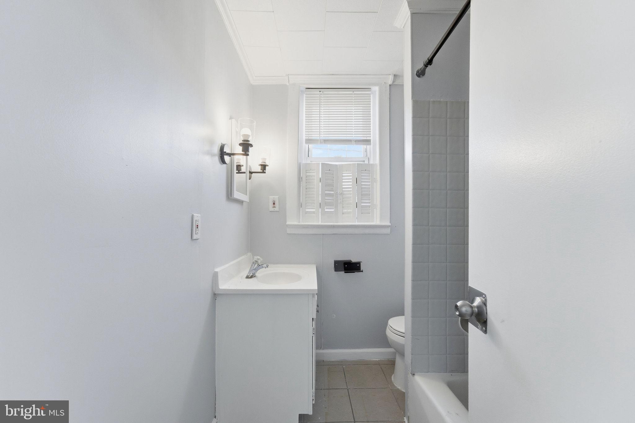 601 Hunter Street Gloucester City, NJ 08030 - Photo 21 of 35 a bathroom with a sink a toilet and shower