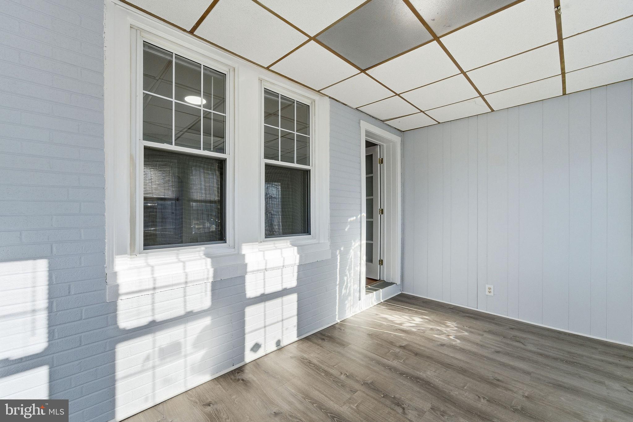 601 Hunter Street Gloucester City, NJ 08030 - Photo 5 of 35 a view of empty room with windows