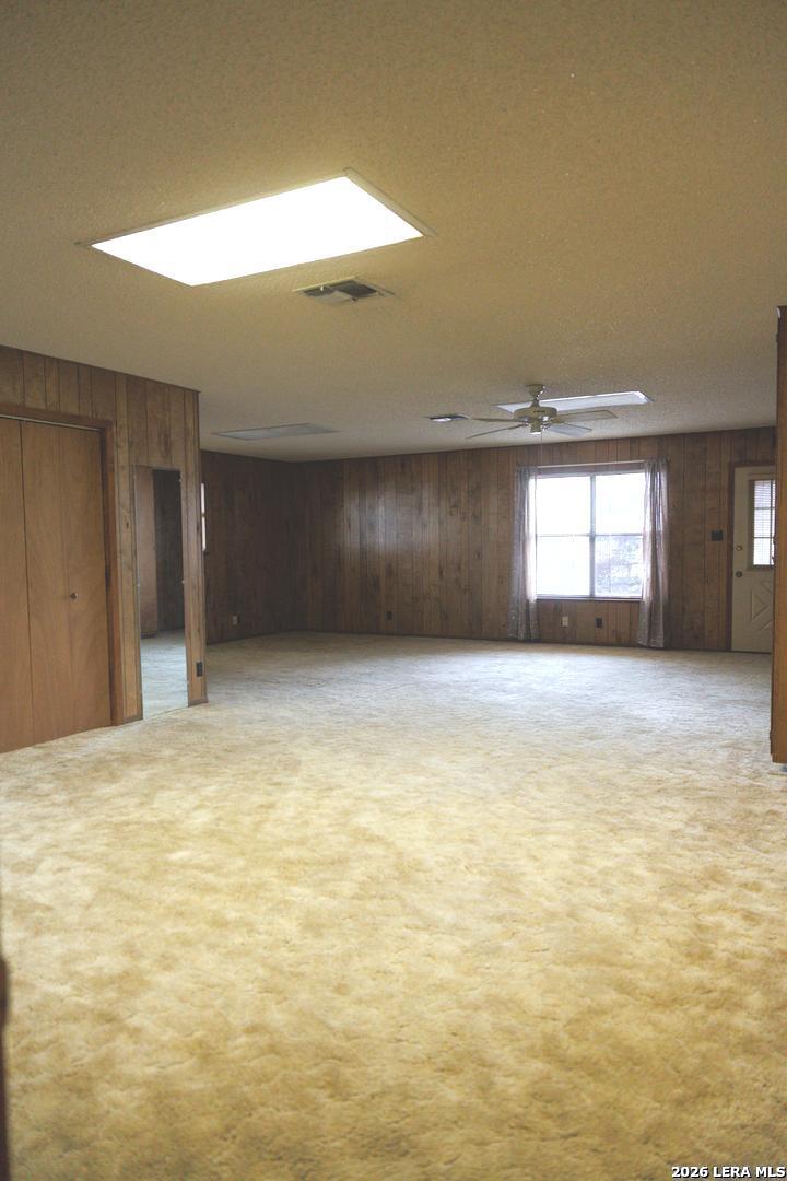 105 South Sayers Drive Devine, TX 78016 - Photo 13 of 23 a view of empty room with window