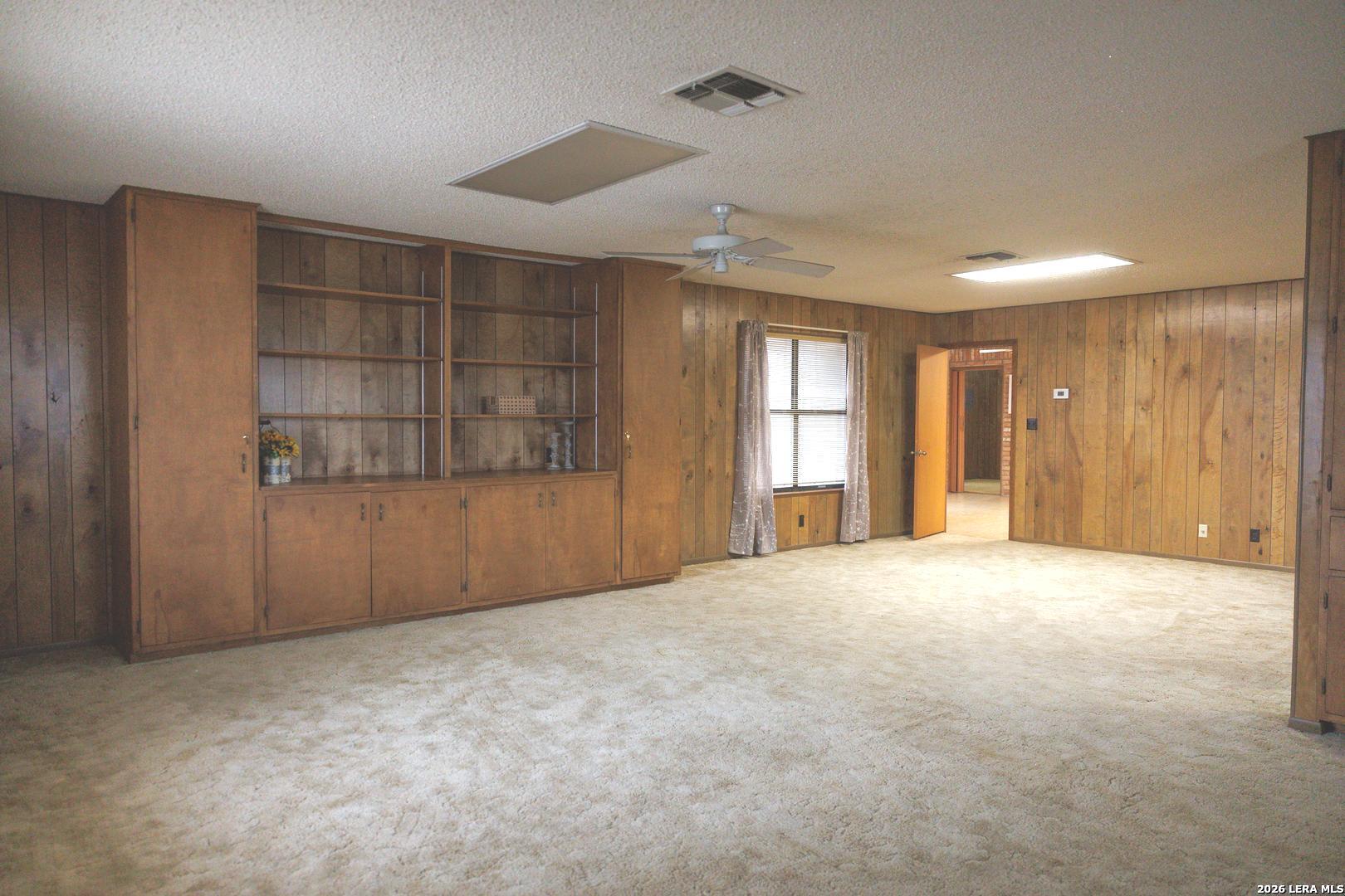 105 South Sayers Drive Devine, TX 78016 - Photo 14 of 23 a view of an empty room with a window