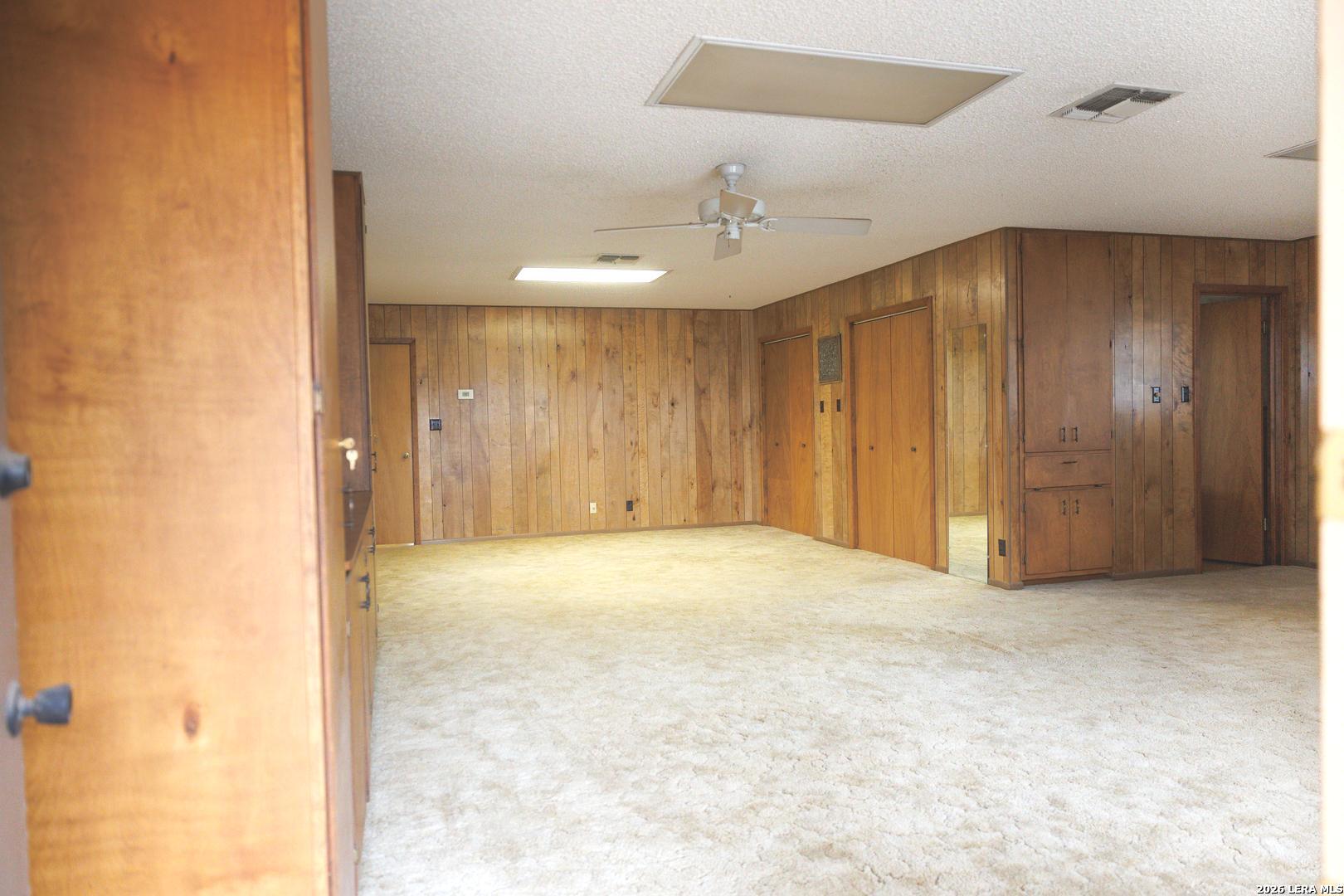 105 South Sayers Drive Devine, TX 78016 - Photo 15 of 23 a view of an empty room and chandelier fan