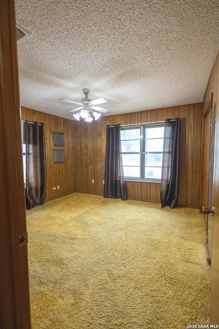 105 South Sayers Drive Devine, TX 78016 - Photo 18 of 23 a view of an empty room with a window