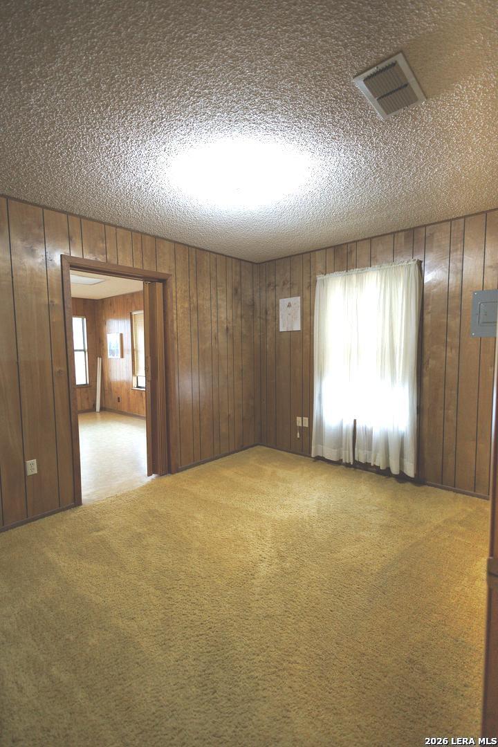 105 South Sayers Drive Devine, TX 78016 - Photo 20 of 23 an empty room with windows and closet