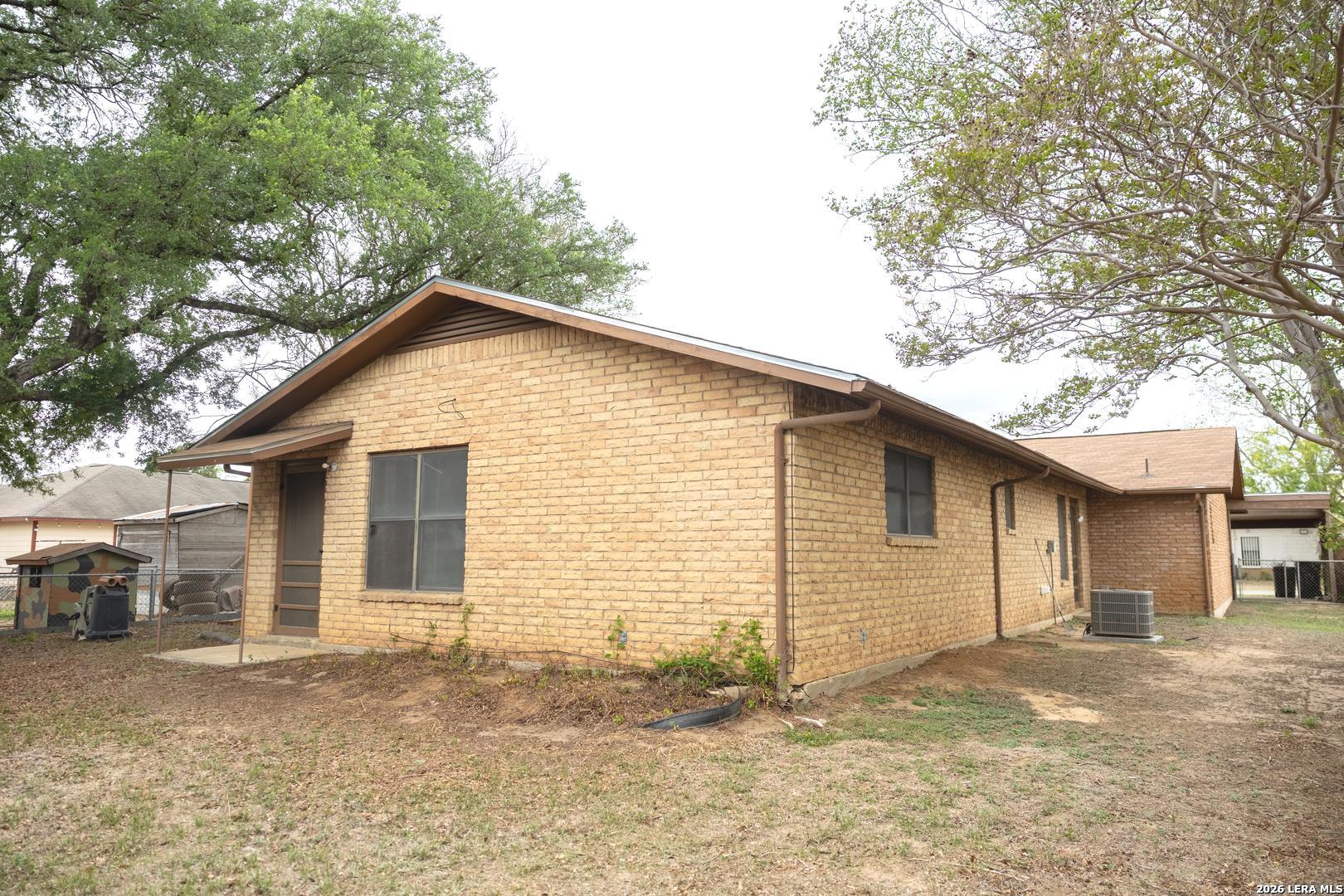105 South Sayers Drive Devine, TX 78016 - Photo 22 of 23 a view of backyard of house