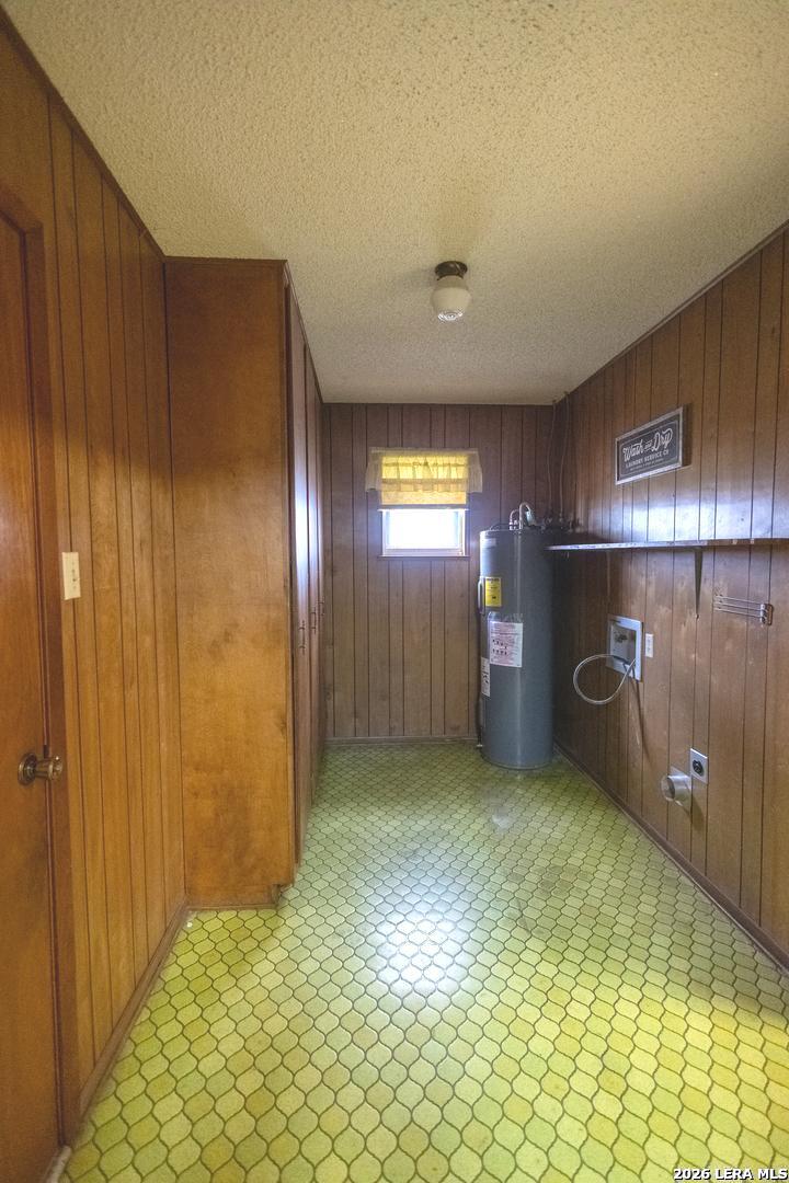 105 South Sayers Drive Devine, TX 78016 - Photo 8 of 23 a view of an empty room with a fireplace and a window