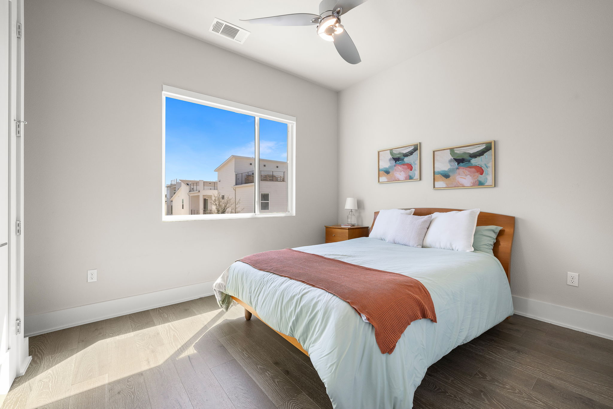 5214 Pink Poppy Pass Austin, TX 78735 - Photo 20 of 34 Bedroom featuring hardwood / wood-style floors and a ceiling fan
