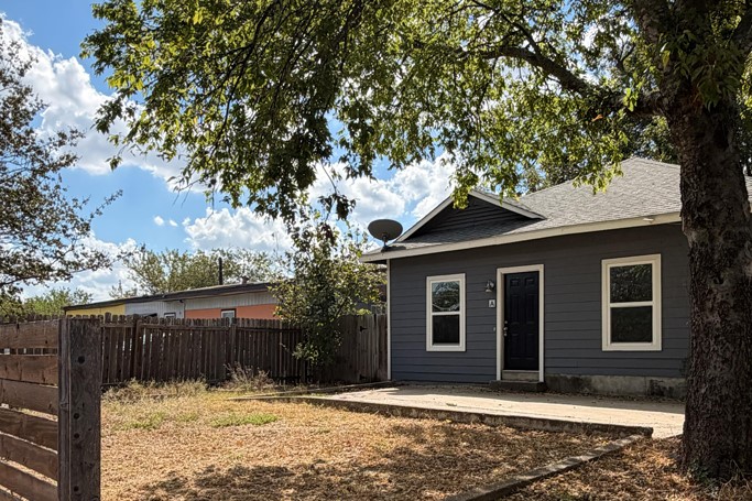 a house with trees in the background