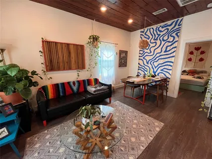 a living room with furniture and a rug