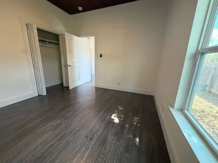 a bathroom with a sink toilet vanity and bathtub