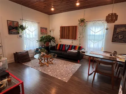a stove top oven sitting inside of a kitchen