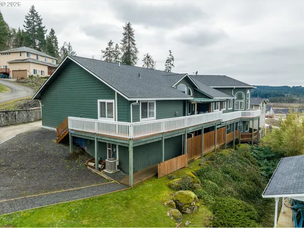a aerial view of a house with a yard and potted plants
