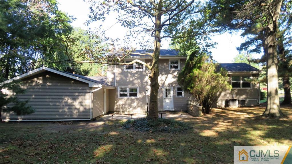 22 Perry Road East Brunswick, NJ 08816 - Photo 8 of 10 a front view of a house with a yard