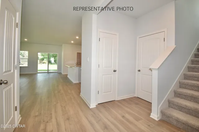a view of entryway with wooden floor
