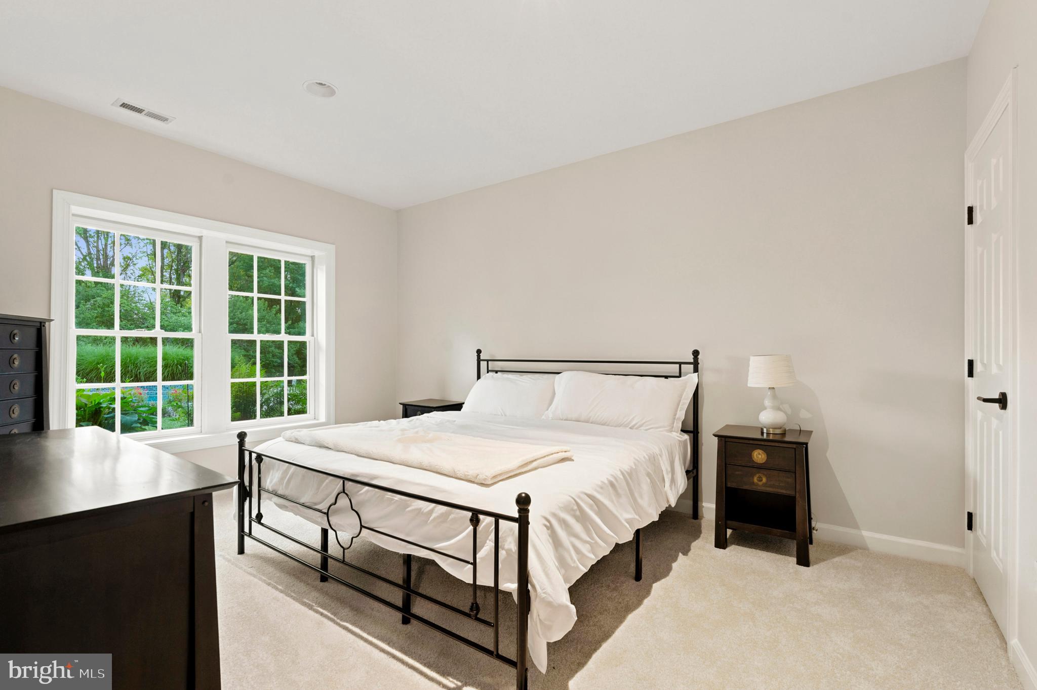 9313 Harrisons Farm Way Laytonsville, MD 20882 - Photo 59 of 77 a bedroom with a bed and a window