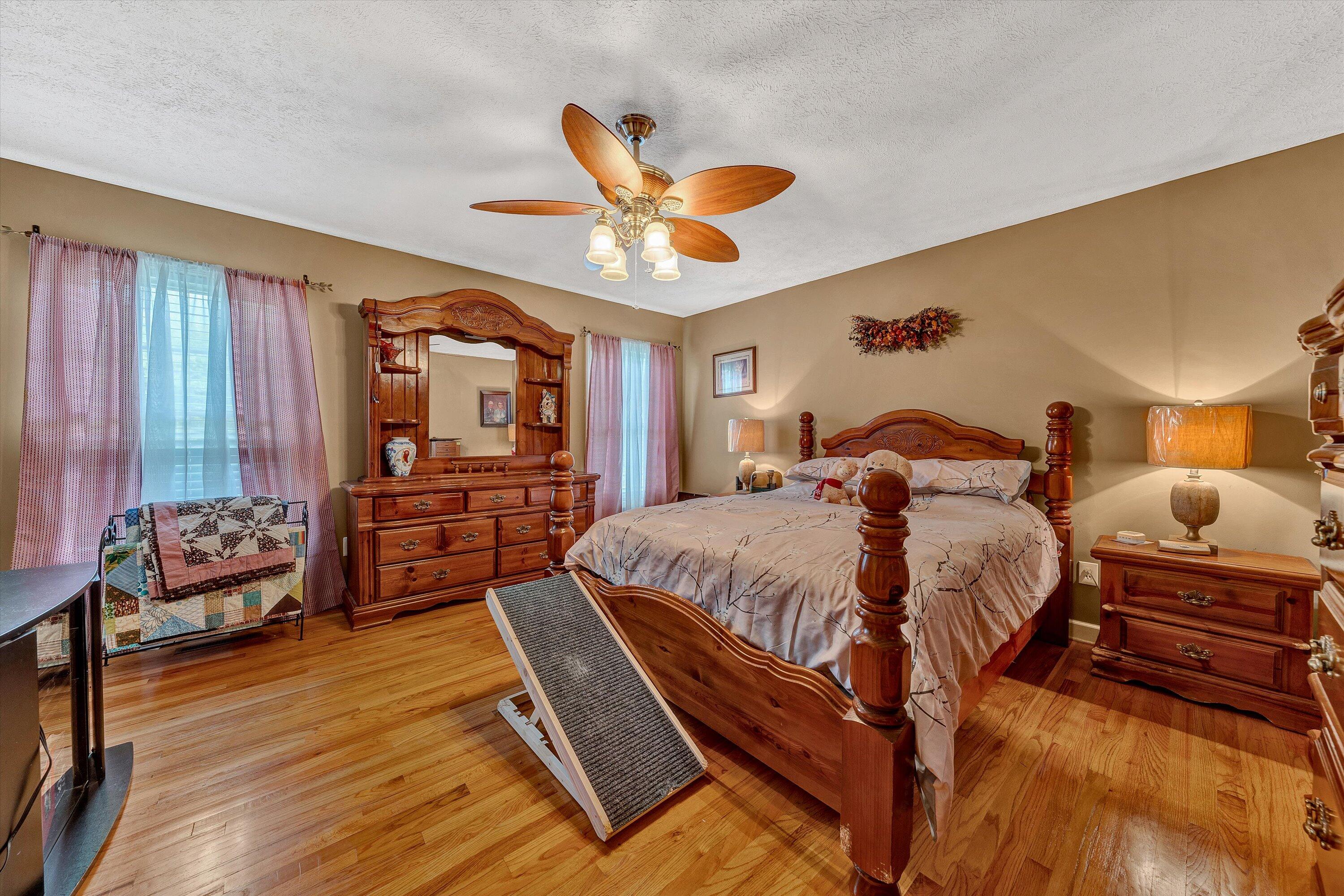 2530 Edwardsville Road Hardy, VA 24101 - Photo 14 of 30 a bedroom with a bed and wooden floor