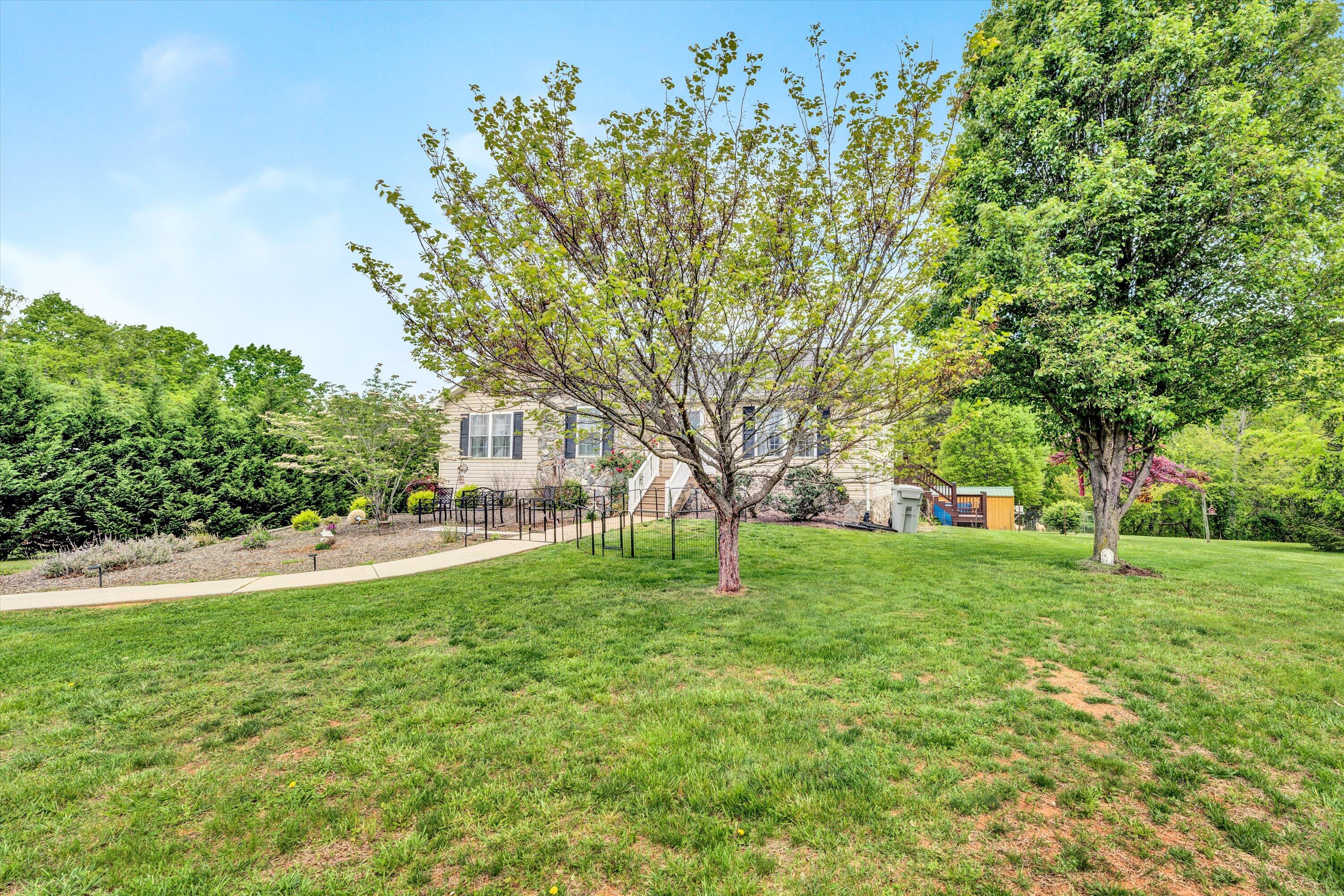 2530 Edwardsville Road Hardy, VA 24101 - Photo 2 of 30 a view of a garden with a tree