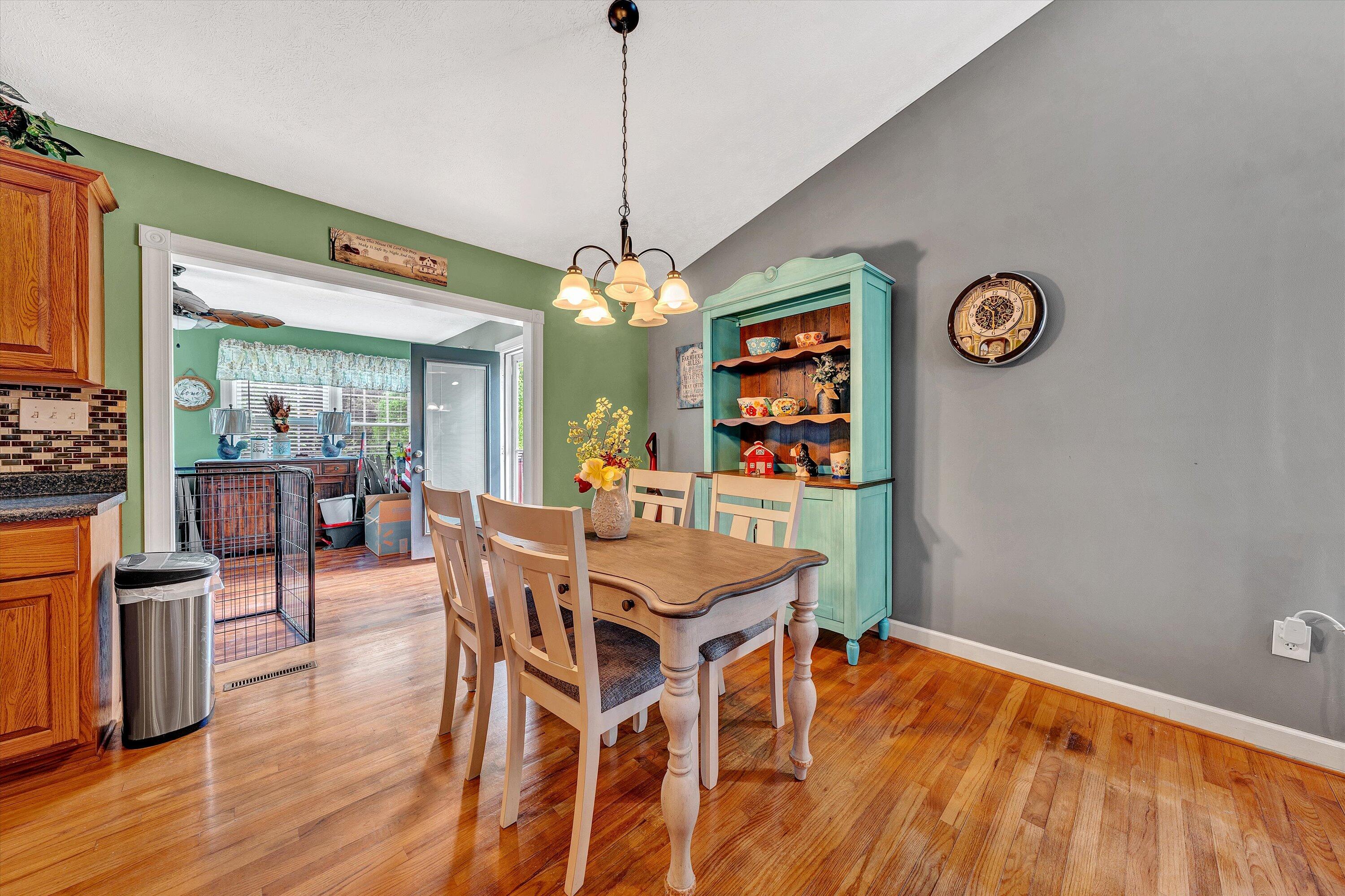 2530 Edwardsville Road Hardy, VA 24101 - Photo 8 of 30 a dining room with a wooden table and chairs