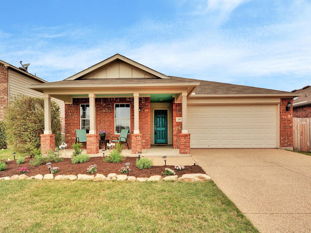 316 Hummingbird Lane Leander, TX 78641 - Photo 1 of 1 a front view of a house with a yard outdoor seating and garage