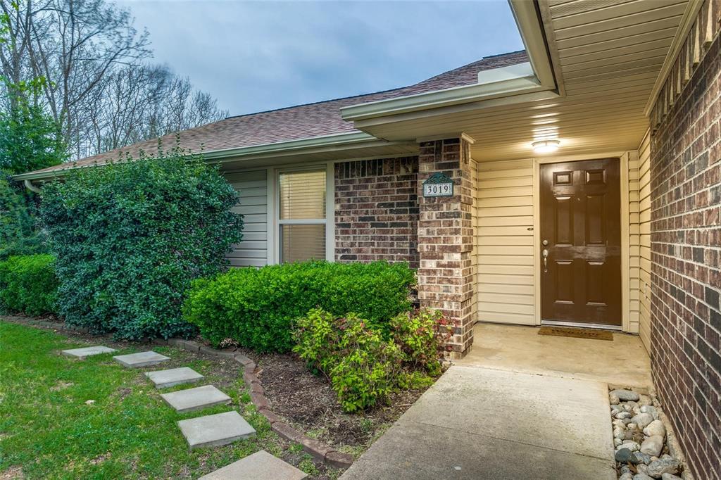 3019 Panhandle Drive Grapevine, TX 76051 - Photo 1 of 1 a front view of a house with garden